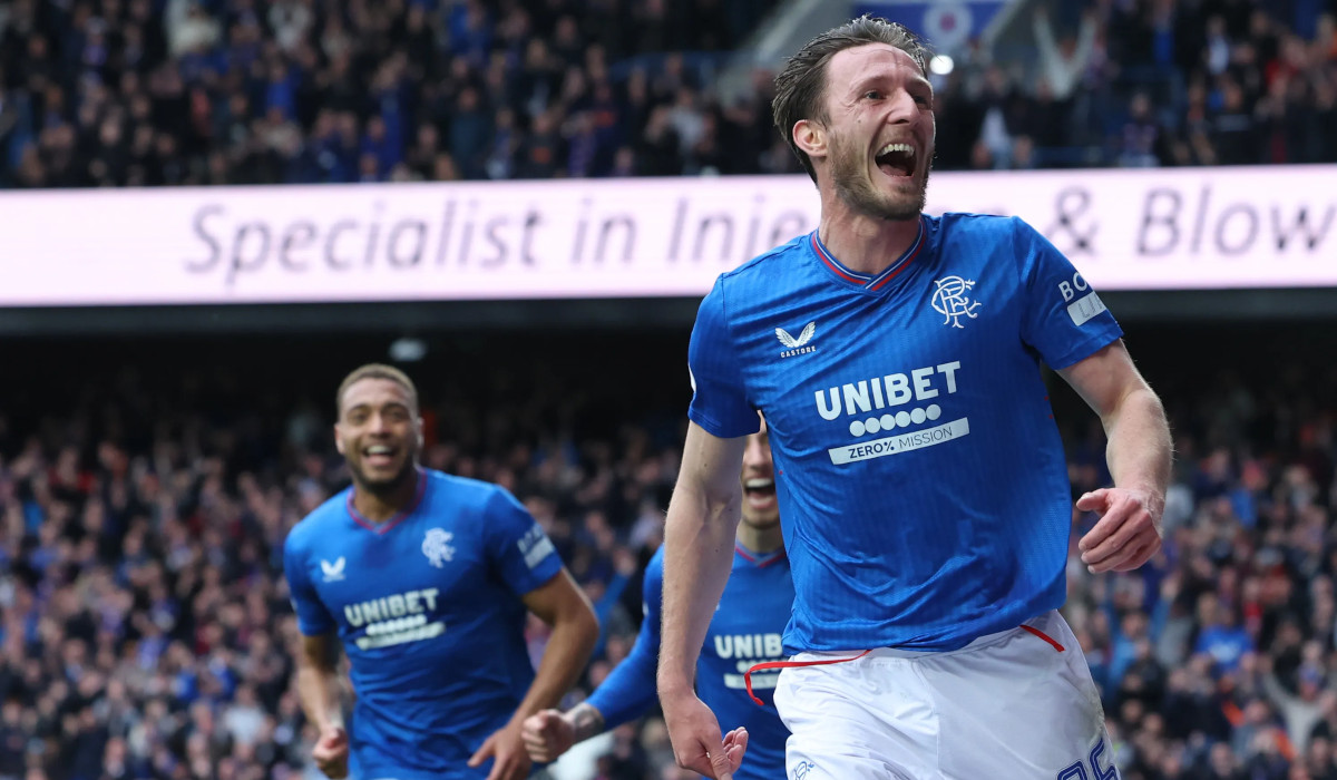 Ben Davies celebrating with Cyriel Dessers in the background